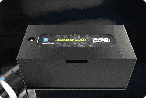 Hot-swappable 6000 mAh / 8.4 V battery slotting into the slider